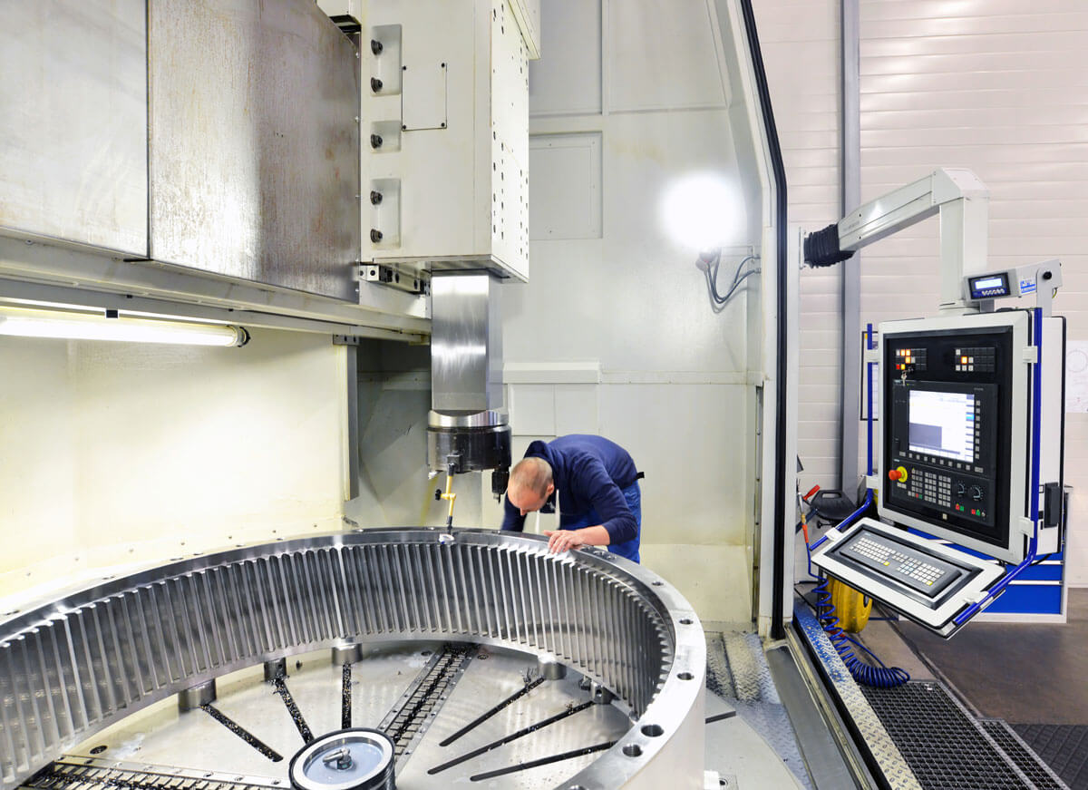 turbine-ring-Factory-of-modern-mechanical-engineering---production-of-gearboxes-for-wind-turbines---worker-at-cnc-milling-machine
