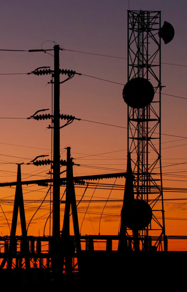 Silhouette-of-Power-Station-with-Transmission-Towers-at-Sunset